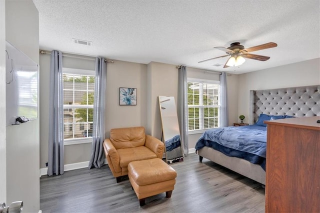 261 Venture Path, Hiram, GA 30141 - bedroom with a textured ceiling, wood finished floors, and a ceiling fan