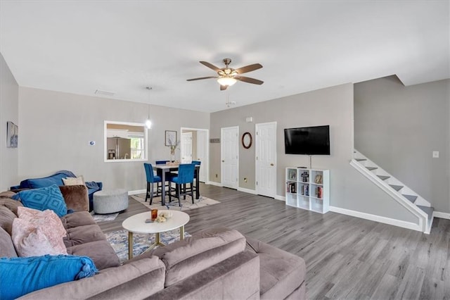 261 Venture Path, Hiram, GA 30141 - living area featuring wood finished floors, ceiling fan, and stairs