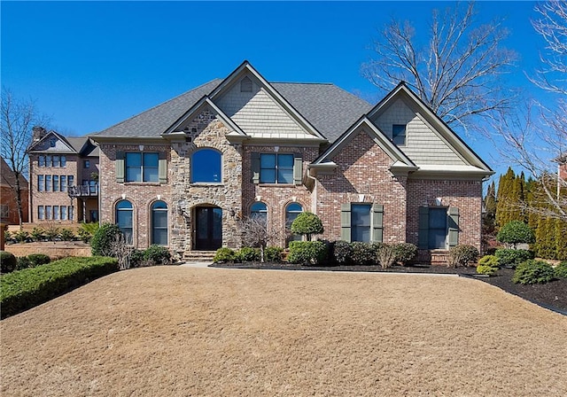 view of front of house featuring brick siding