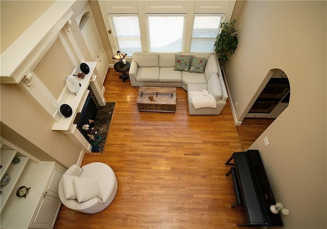 living room featuring light wood-style floors and baseboards