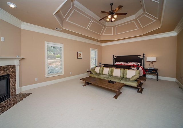 bedroom with carpet floors, a high end fireplace, visible vents, and crown molding