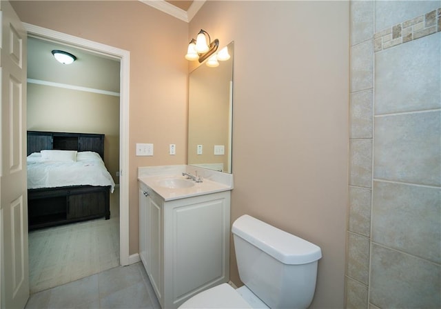 bathroom featuring ensuite bathroom, toilet, vanity, tile patterned floors, and crown molding