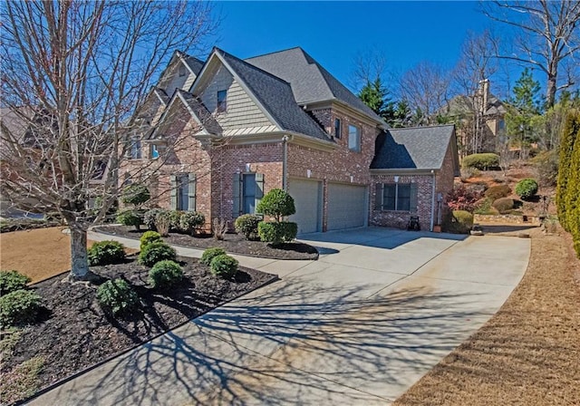 view of front of home with a garage, concrete driveway, brick siding, and a shingled roof