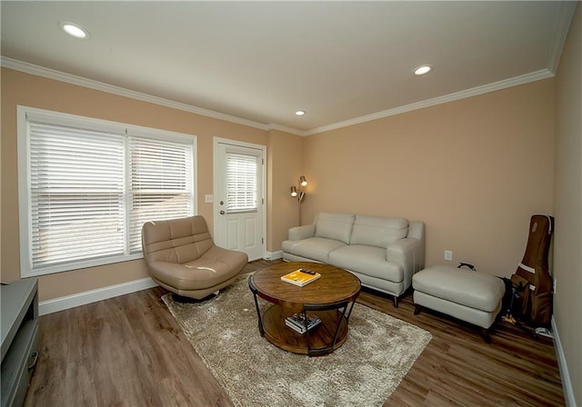 living room with ornamental molding, recessed lighting, wood finished floors, and baseboards