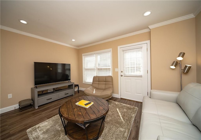 living area with crown molding, baseboards, and wood finished floors