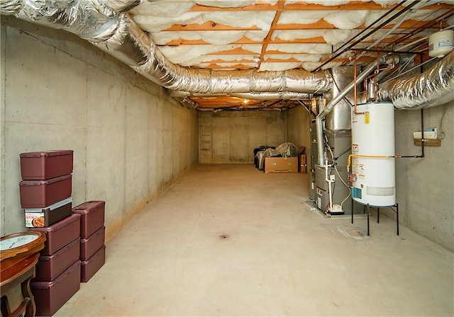 unfinished basement with heating unit and gas water heater