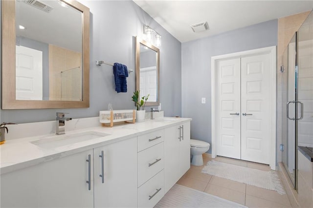 full bathroom featuring a stall shower, visible vents, and a sink