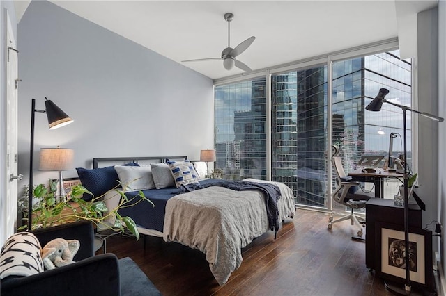 bedroom featuring a ceiling fan, floor to ceiling windows, and hardwood / wood-style floors