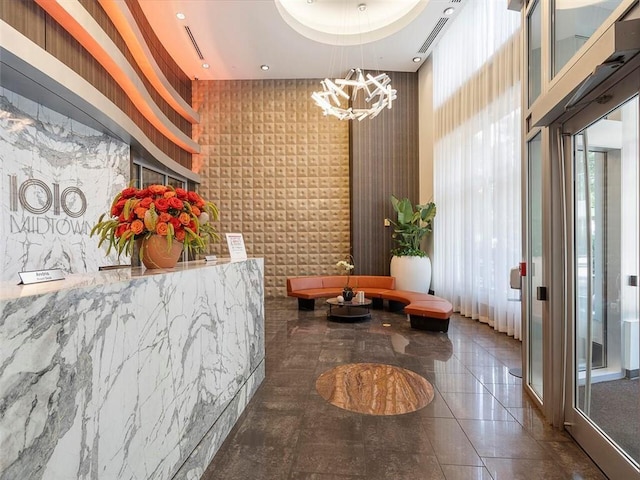 reception area with visible vents and a notable chandelier