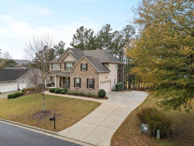 view of front facade featuring a front yard and a garage