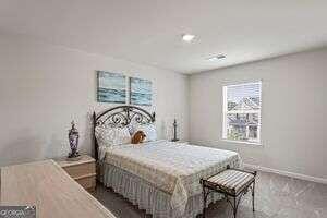 bedroom featuring dark carpet