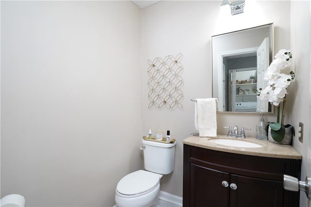 bathroom with vanity and toilet