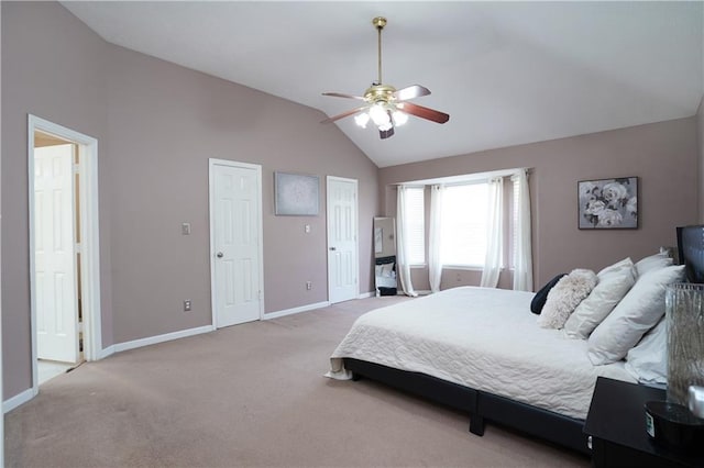 carpeted bedroom featuring ceiling fan and vaulted ceiling