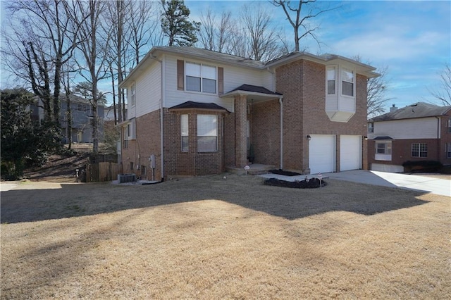 view of property featuring a garage, central AC unit, and a front yard