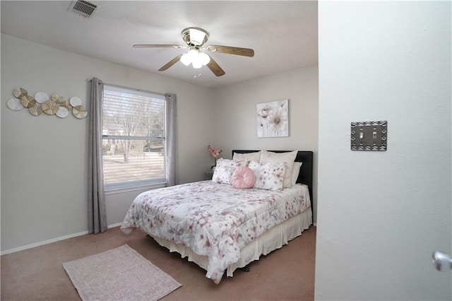 bedroom with ceiling fan and carpet flooring