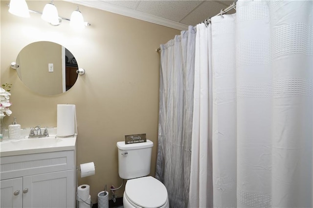 bathroom featuring crown molding, vanity, and toilet