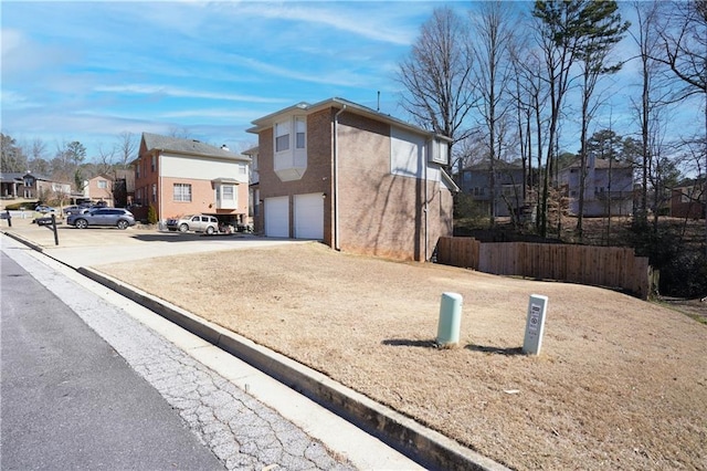 view of property exterior with a garage