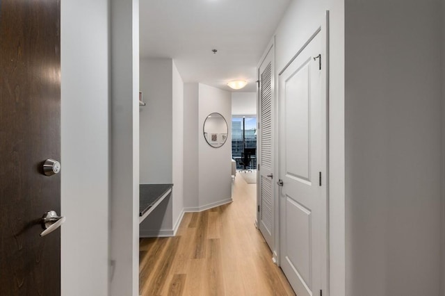 855 Peachtree St NE Unit 2706, Atlanta, GA 30308 - hall featuring light wood-type flooring and baseboards
