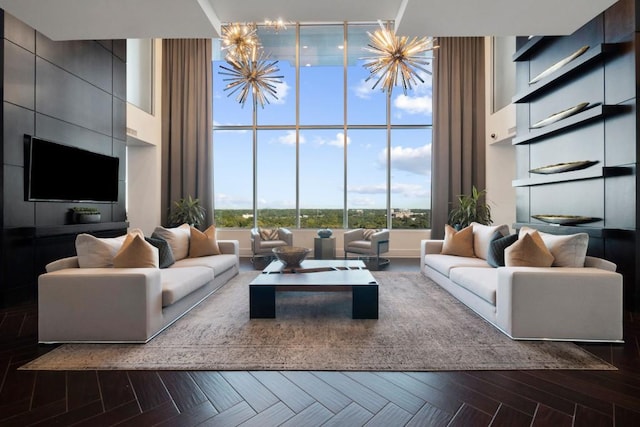 855 Peachtree St NE Unit 2706, Atlanta, GA 30308 - living area featuring a chandelier, a towering ceiling, and parquet floors