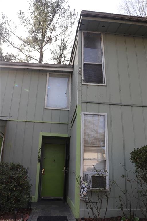 doorway to property featuring cooling unit