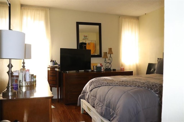 bedroom featuring dark hardwood / wood-style flooring