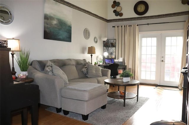 living room with wood-type flooring and french doors