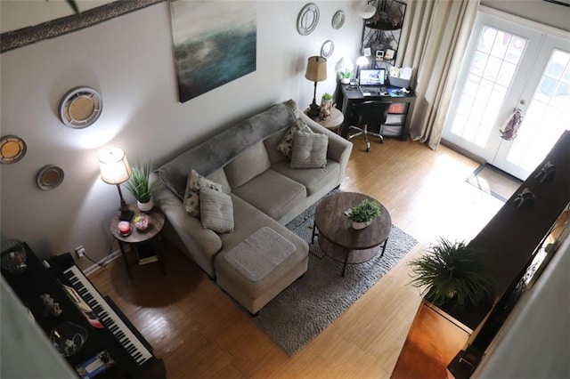 living room with french doors and hardwood / wood-style floors