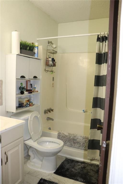 full bathroom with toilet, vanity, and shower / bath combo with shower curtain