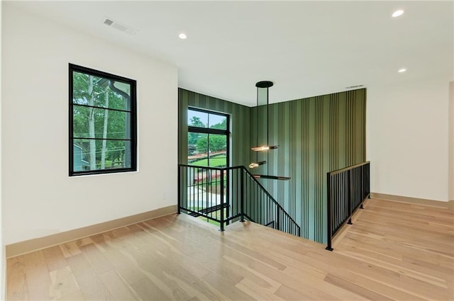 spare room featuring wood-type flooring