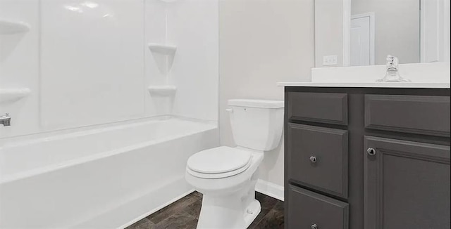 full bathroom with vanity, toilet, baseboards, and shower / bathtub combination