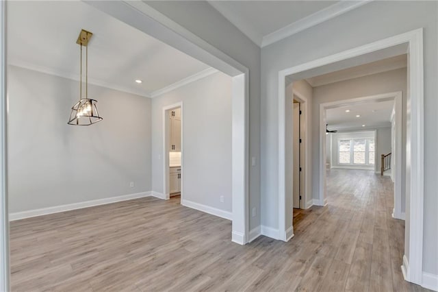 interior space featuring light wood-type flooring, baseboards, recessed lighting, and ornamental molding