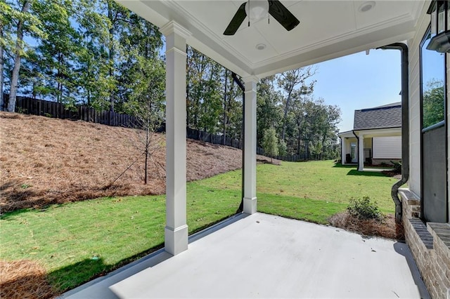 view of patio with fence and a ceiling fan
