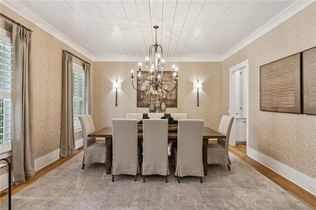 150 Trinity Farm Dr, Canton, GA 30115 - dining space with ornamental molding, wood finished floors, a chandelier, and wallpapered walls