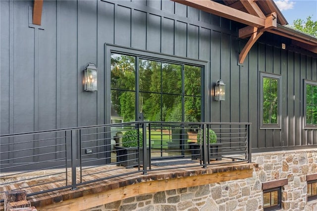 150 Trinity Farm Dr, Canton, GA 30115 - doorway to property featuring board and batten siding and stone siding