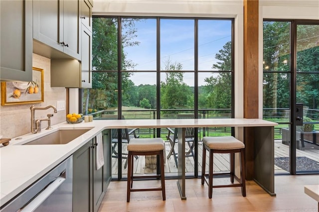 150 Trinity Farm Dr, Canton, GA 30115 - kitchen featuring dishwasher, tasteful backsplash, light wood-style floors, and light stone counters