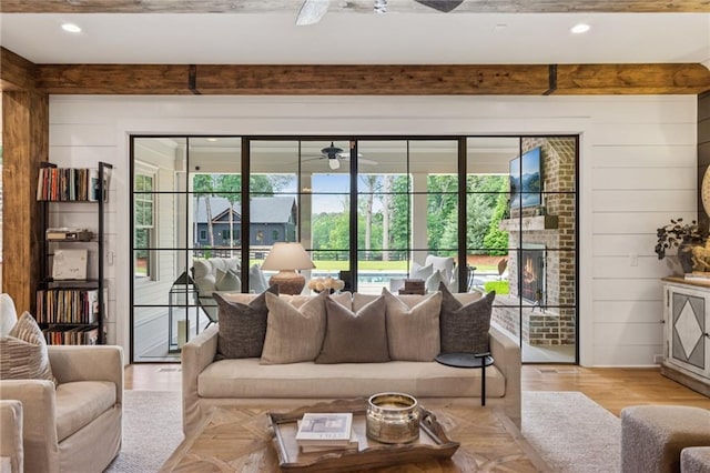 150 Trinity Farm Dr, Canton, GA 30115 - living room with a ceiling fan, beam ceiling, wood walls, and light wood-type flooring