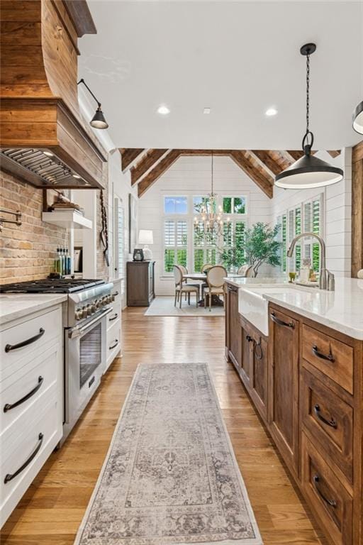 150 Trinity Farm Dr, Canton, GA 30115 - kitchen featuring high end stainless steel range oven, light wood-type flooring, a chandelier, tasteful backsplash, and recessed lighting