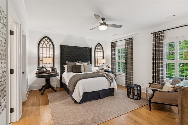 150 Trinity Farm Dr, Canton, GA 30115 - bedroom with multiple windows, light wood-style flooring, and a ceiling fan