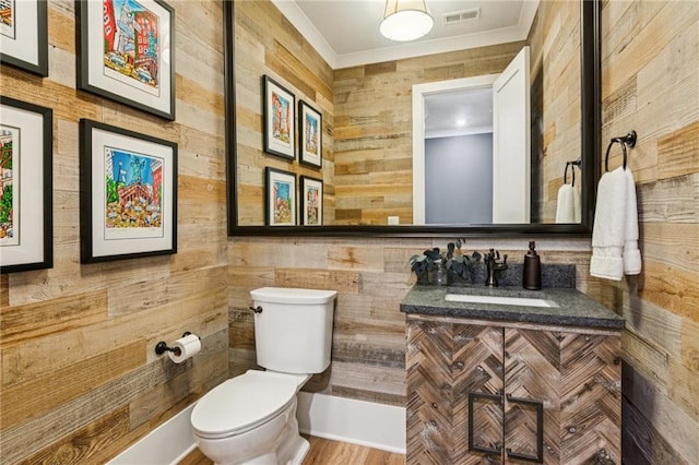 150 Trinity Farm Dr, Canton, GA 30115 - half bathroom featuring ornamental molding, vanity, and wood walls