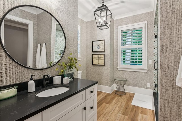 150 Trinity Farm Dr, Canton, GA 30115 - bathroom with wood finished floors, a chandelier, vanity, ornamental molding, and decorative backsplash