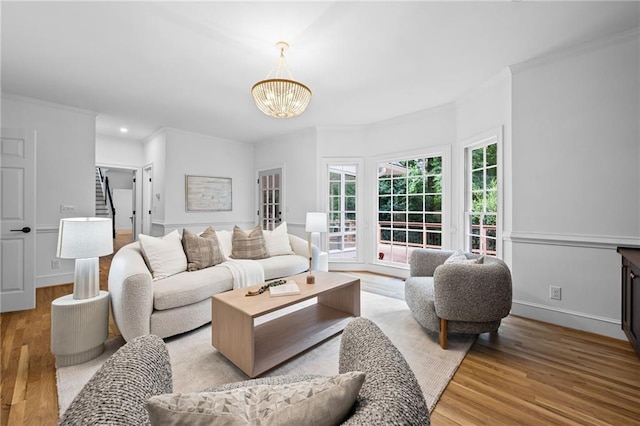 1017 Mill Creek Mnr NE, Brookhaven, GA 30319 - living room featuring ornamental molding, a chandelier, wood finished floors, and recessed lighting