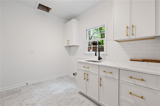 1017 Mill Creek Mnr NE, Brookhaven, GA 30319 - washroom with cabinet space and light marble finish flooring