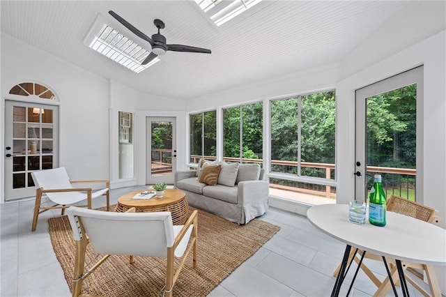 1017 Mill Creek Mnr NE, Brookhaven, GA 30319 - sunroom featuring a ceiling fan, an outdoor hangout area, a skylight, and lofted ceiling
