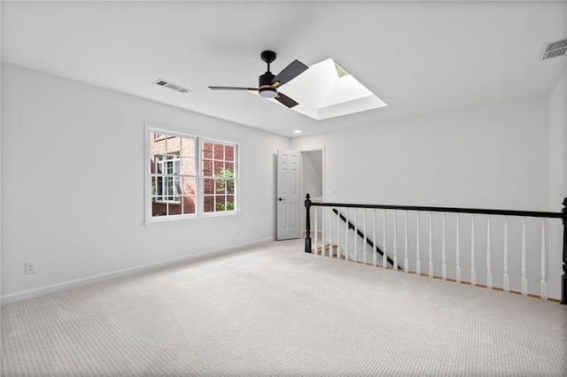 1017 Mill Creek Mnr NE, Brookhaven, GA 30319 - carpeted spare room with a skylight and ceiling fan