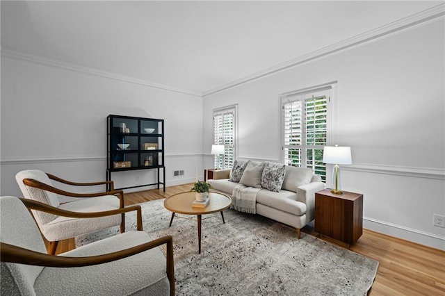 1017 Mill Creek Mnr NE, Brookhaven, GA 30319 - living room featuring wood finished floors and ornamental molding