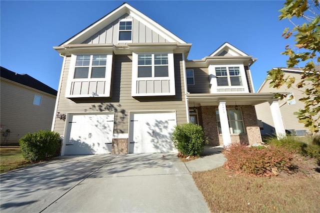 view of front of home featuring brick siding, board and batten siding, an attached garage, and concrete driveway