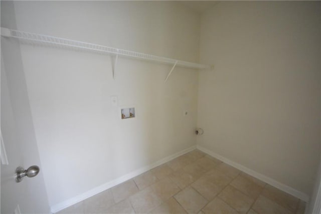 washroom featuring laundry area, hookup for a washing machine, and baseboards