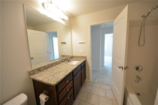 bathroom featuring baseboards, toilet, bathtub / shower combination, tile patterned floors, and vanity