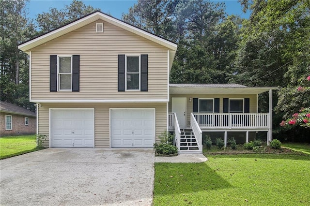 tri-level home featuring a front yard, covered porch, and a garage