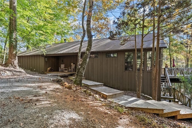 view of side of property with a deck